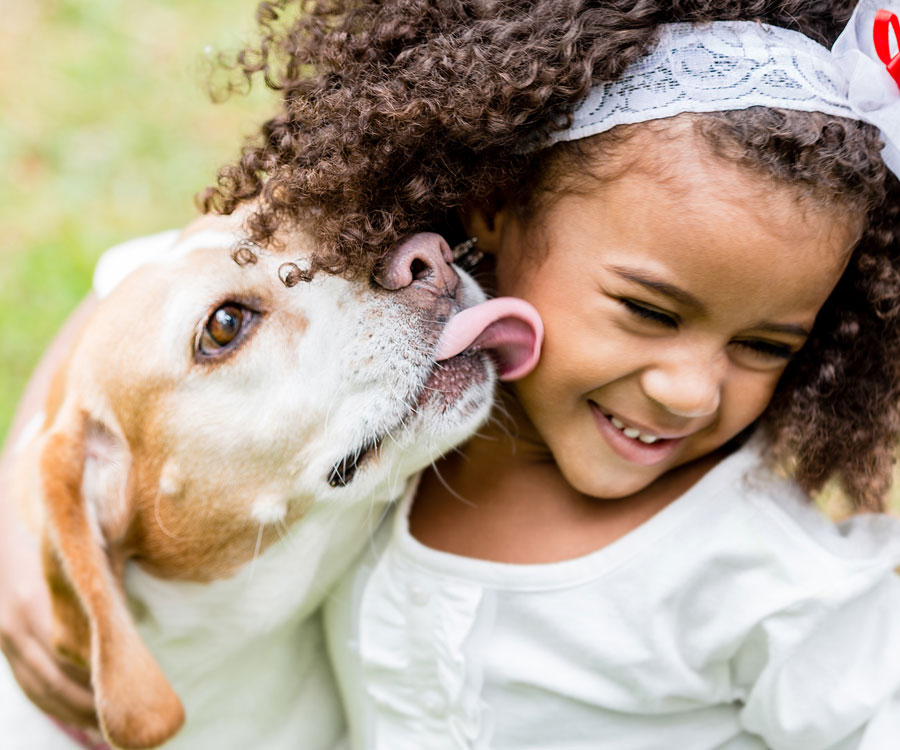 Girl and dog playing. Kids and dogs need supervision.