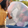 woman throwing out trash, disposing of flea and tick products