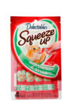 Delectables SqueezUp chicken and veggies is the first gourmet wet cat treat where feeding is interactive. Front of package picturing a cat eating from a squeezeup tube being held by a hand.