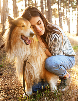 A young woman and an old dog